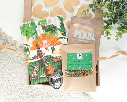 Brievenbuscadeau Geluk in de brievenbus met A5 notitieboek, rosé pen, geluksthee en pearl gezichtsmasker