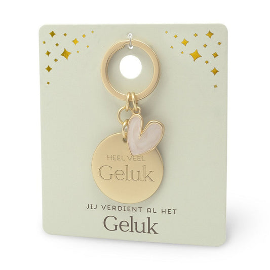 goudkleurige sleutelhanger met epoxy hartje met de tekst heel veel geluk