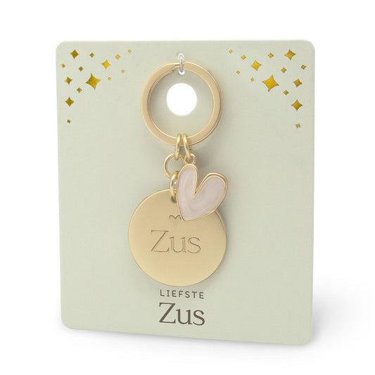 sleutelhanger met hartje in goudkleur met de tekst 'zus' erop gegraveerd.