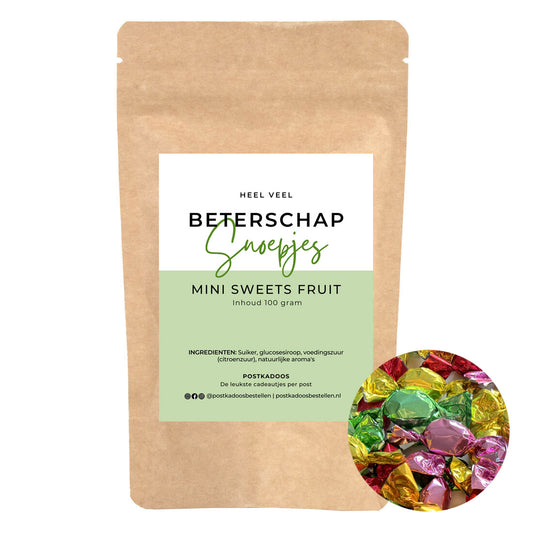 Zak snoep met de opdruk heel veel beterschap. De zak is gevuld met gekleurde snoepjes.